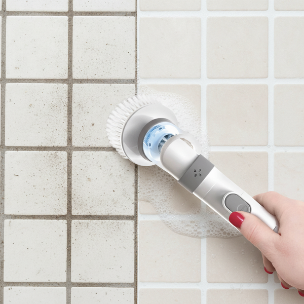 Dirty grout on the left, clean grout on the right after the spin scrubber